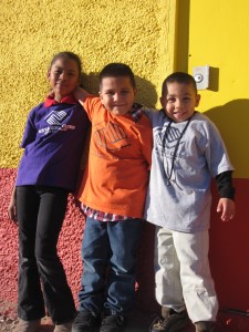 Three Club Children hugging